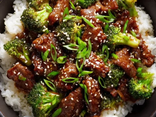 Chinese Beef and Broccoli served with rice and sesame garnish