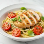 Healthy bruschetta chicken pasta with fresh basil and tomatoes