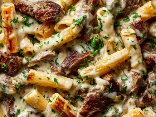 Delicious Philly Cheese Steak Pasta Recipe served hot in a skillet