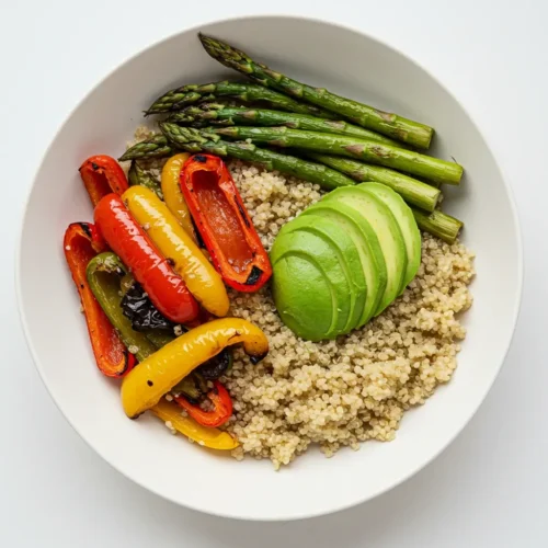 Healthy quinoa bowl with roasted vegetables and avocado.